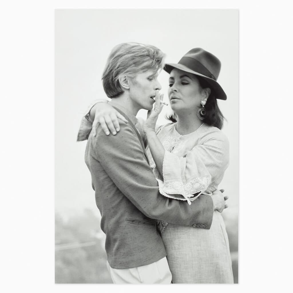 Terry O’Neill limited edition print titled ‘David Bowie with Elizabeth Taylor’ depicting the legendary performer and film star in classic photographic style