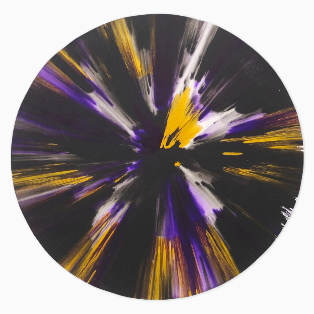 Spin painting by Damien Hirst in black, yellow, and purple radiating streaks of paint swirling outward from the center, with layered splashes and drips creating a dynamic circular composition dominated by bold contrasts between dark and vibrant hues.